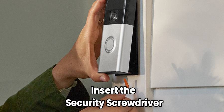 Insert the
Security Screwdriver