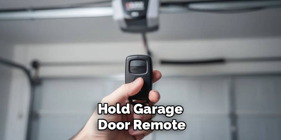 Hold Garage 
Door Remote