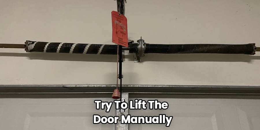 Try To Lift The 
Door Manually