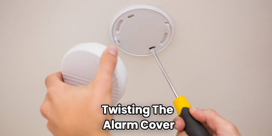 Twisting The 
Alarm Cover