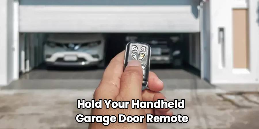 Hold Your Handheld
Garage Door Remote