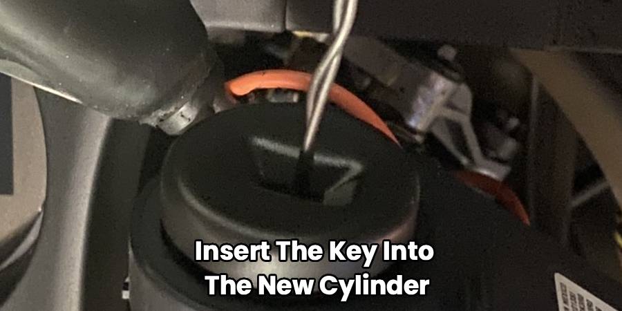 Insert The Key Into 
The New Cylinder