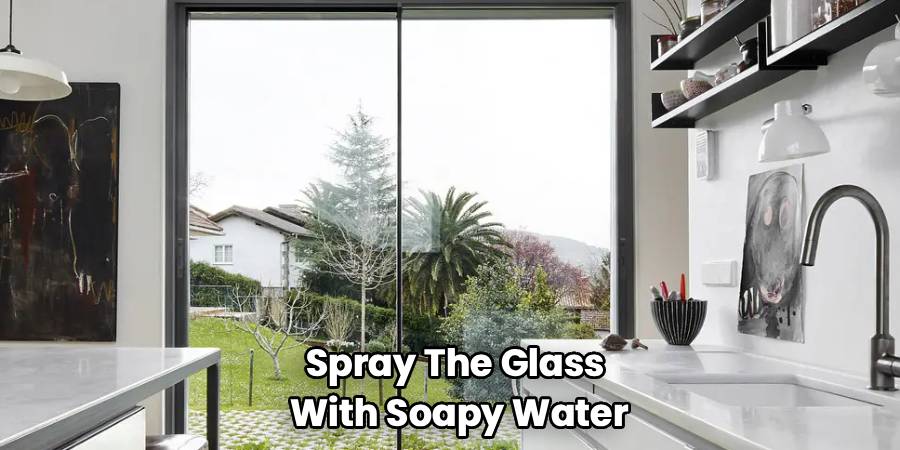 Spray The Glass
With Soapy Water