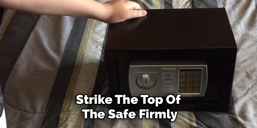 Strike The Top Of 
The Safe Firmly