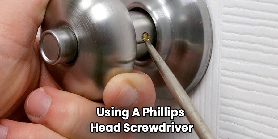 Using A Phillips 
Head Screwdriver